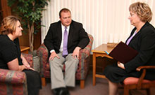 Two people meeting with a Cedar Memorial counselors 